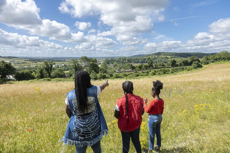 A family admire the views across fields at Ranscombe Farm.