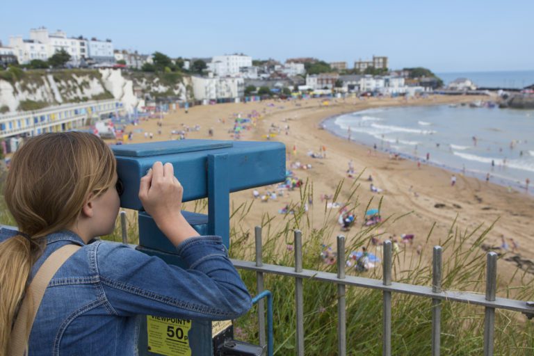 Girl looking through telescope at Broadstairs