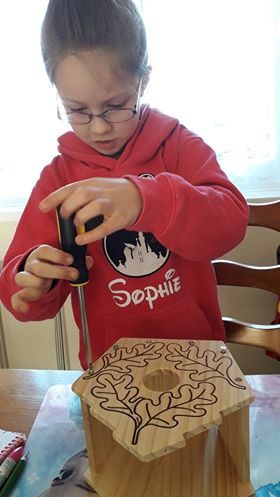 Child doing woodwork