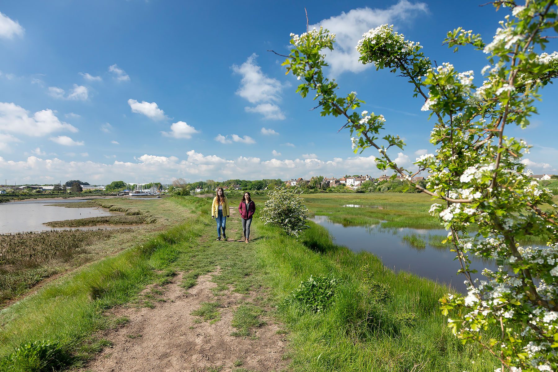 Girls walking at oare marshes