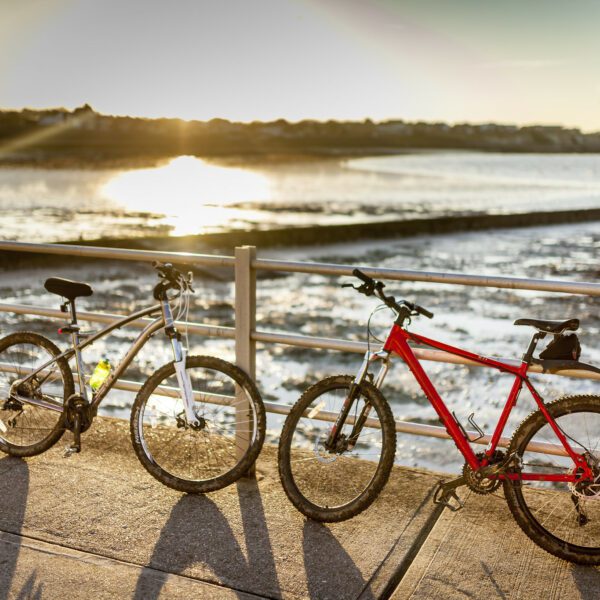 Bikes on the beach with sunset at Westgate beach