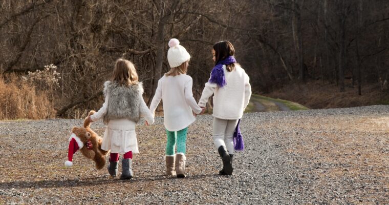 Kids walking outdoors in their Christmas outfits