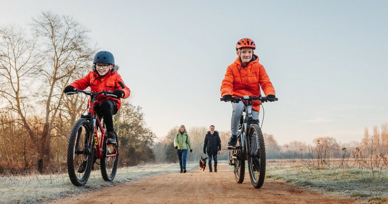 Children cycling on a winter day
