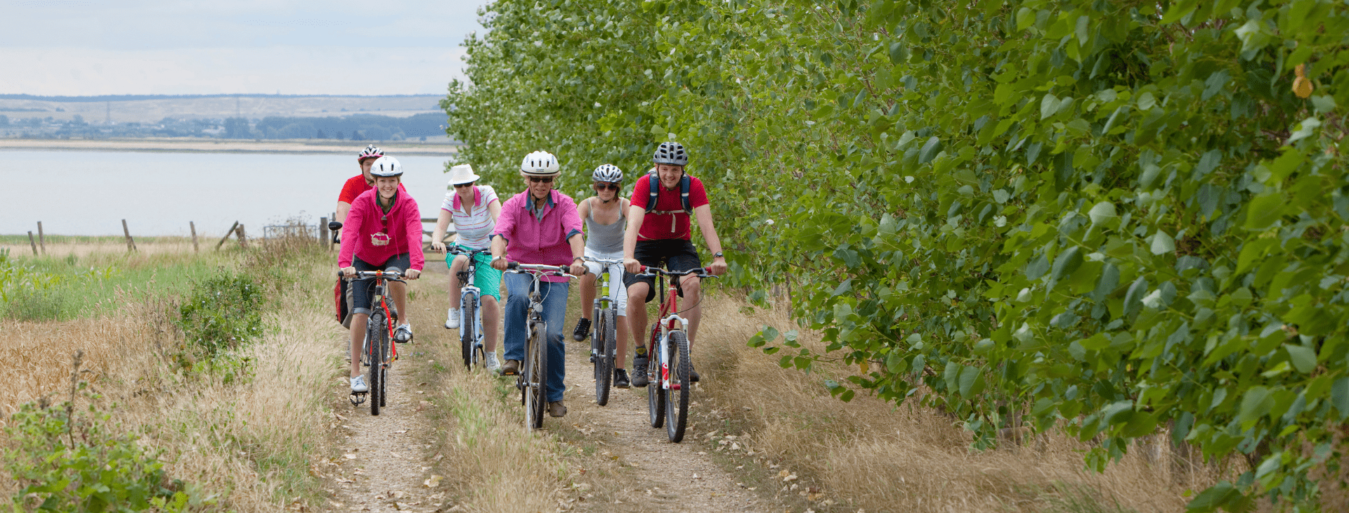 Group of people cycling outside