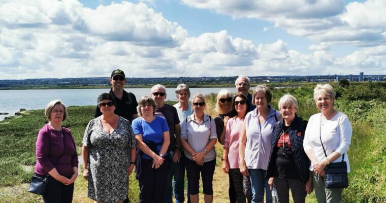 Just Beat It group of walkers on the banks of the river Medway on the Hoo esturary