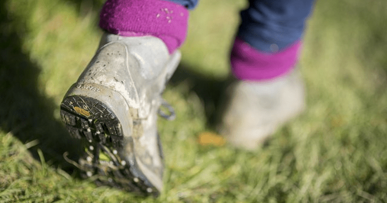 Image of a person's walking boots