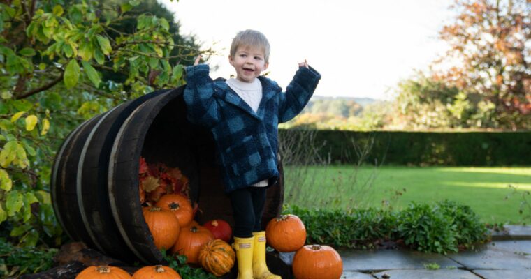 A family exploring the pumpkin trail at Hinton Ampner, Hampshire