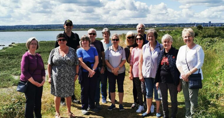 Just Beat It group of walkers on the banks of the river Medway on the Hoo esturary