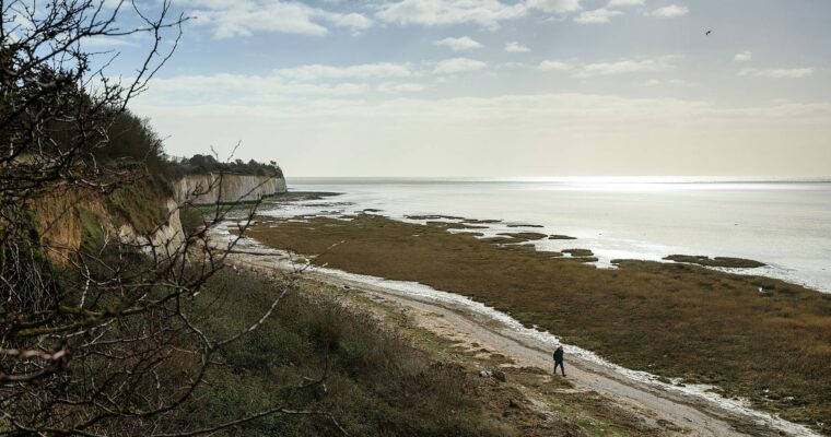 Person walking on beach at Pegwell Bay Ramsgate