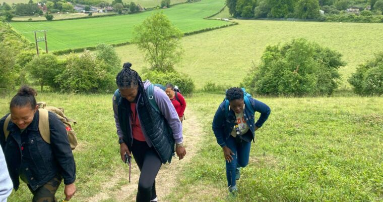 A group of hikers walk through the New Nature Reserve.