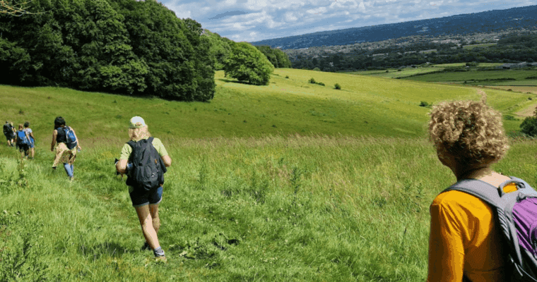 Group of walkers walking along a trail in the countryside