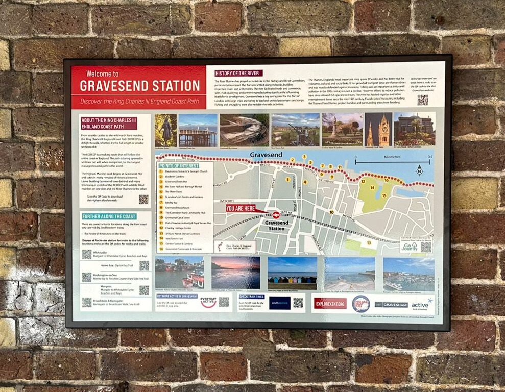 Brick wall displaying a map of Gravesend and photos.