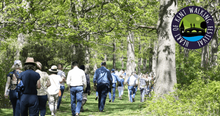 People walking with the Heart of Kent Walking Festival logo