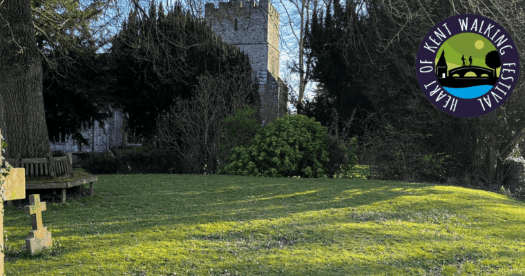 Church grounds with the Heart of Kent Walking Festival logo