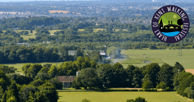 View of the Kent countryside with the Heart of Kent Walking Festival logo