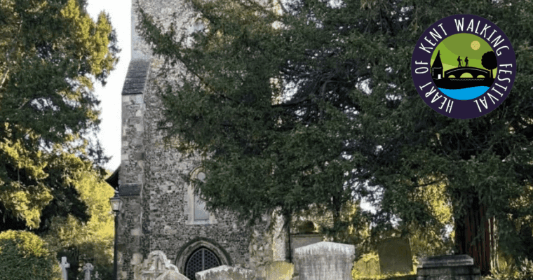 Outside of a church with the Heart of Kent Walking Festival logo