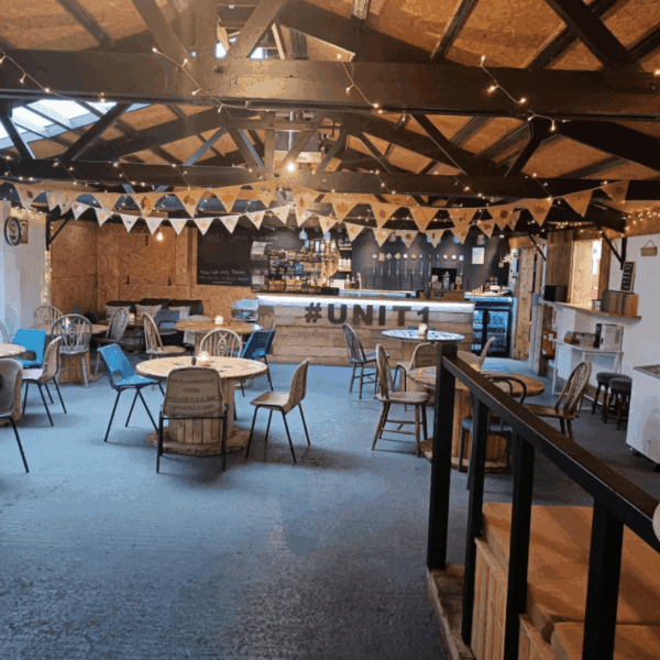 Interior of cafe. Banners and signage in a barn styled building
