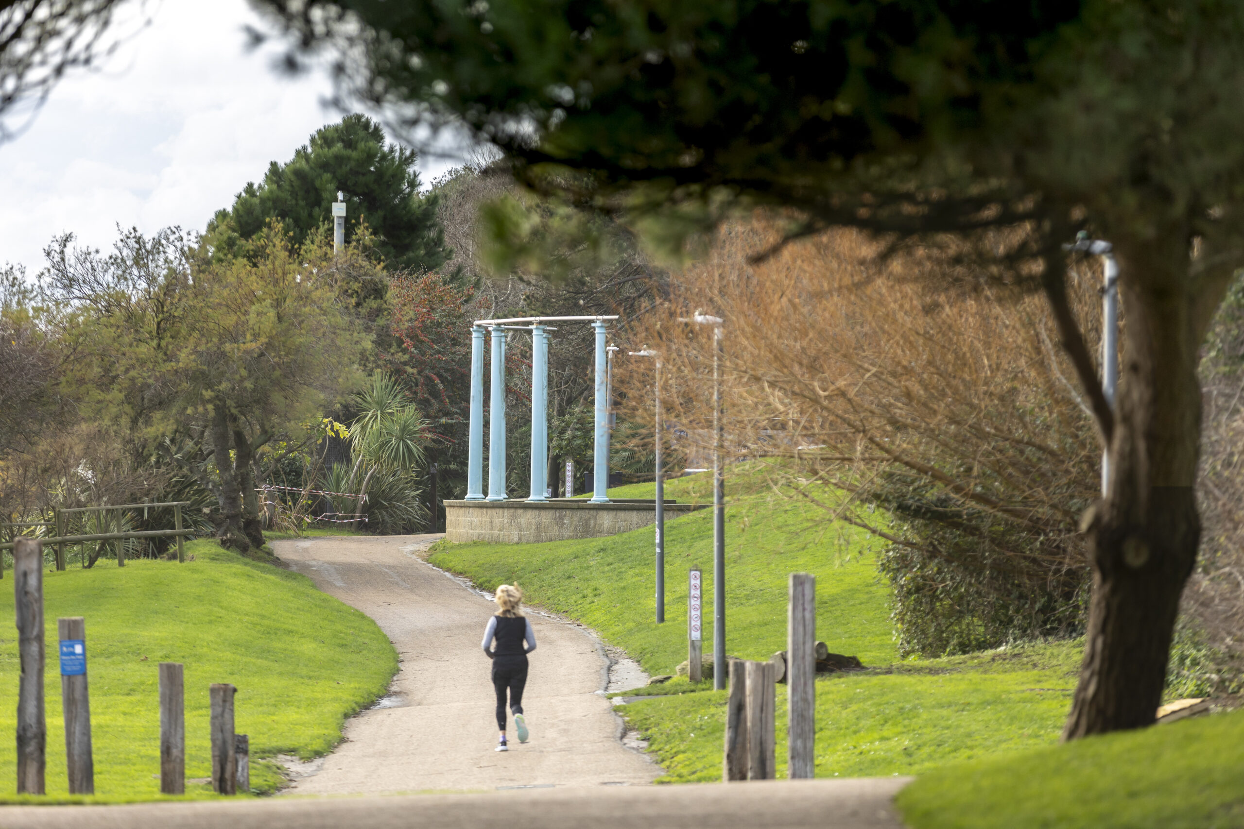 a person jogging through Lower Leas Coastal Park