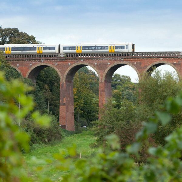 Train going over a viaduct bridge
