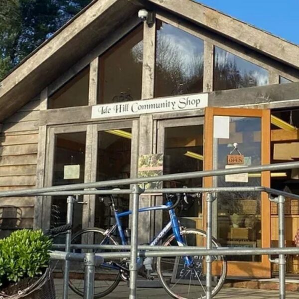 The entrance to Ide Hill Community Shop with a bicycle parked outside.