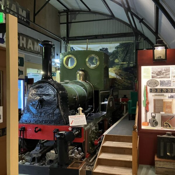 A large model of a train and display cases in a museum, Colonel Stephens Railway Museum, Tenterden.