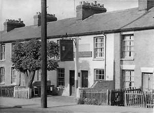 A black and white image of a row of houses.