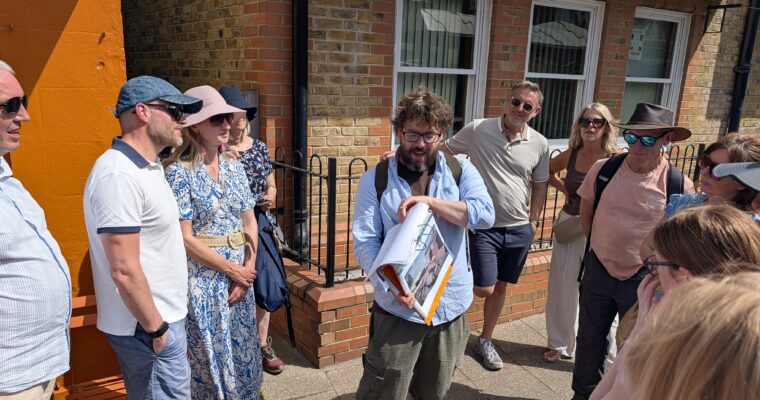 Person giving a tour to group of people